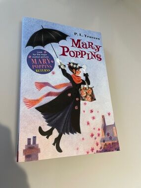 Mary Poppins Illustrated Paperback - Light Blue Cover with Black Coat